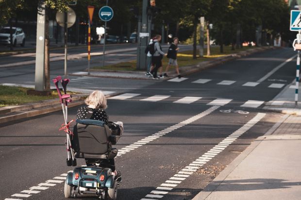 Disabled woman in a motorized wheelchair