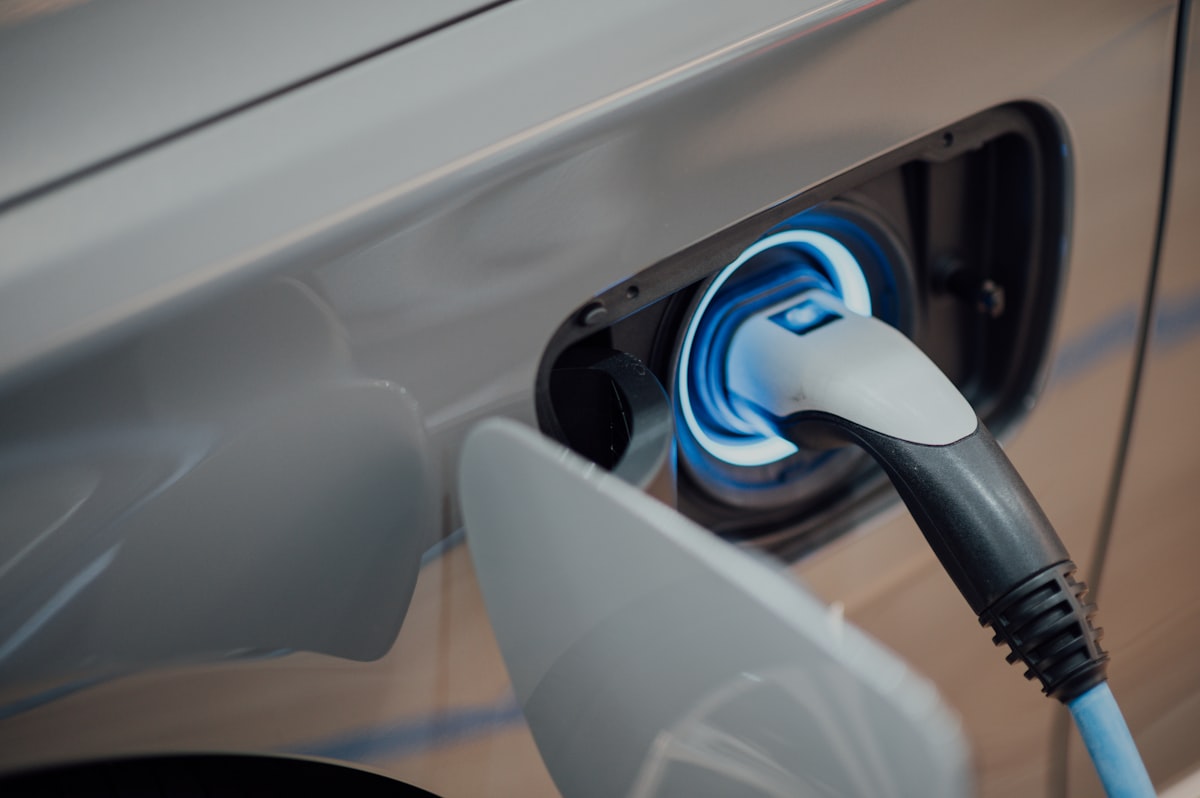 Electric vehicle plugged in for charging, representing EV lemon law defects